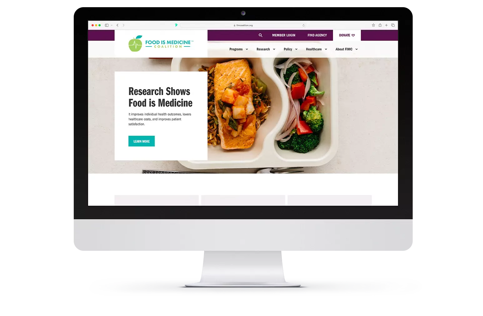 Desktop monitor displaying FIMC's newly redesigned homepage
