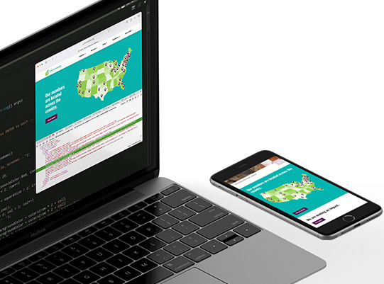 Laptop and phone showing the process of developing the new FIMC website